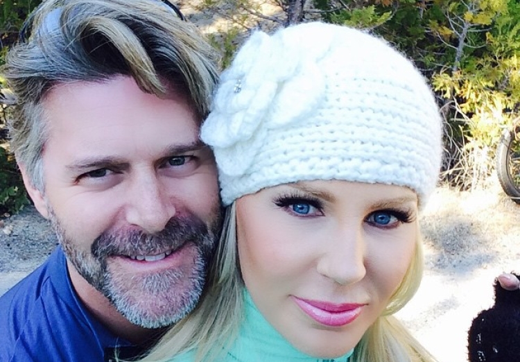 Gretchen Rossi wears a knit hat and green turtleneck.