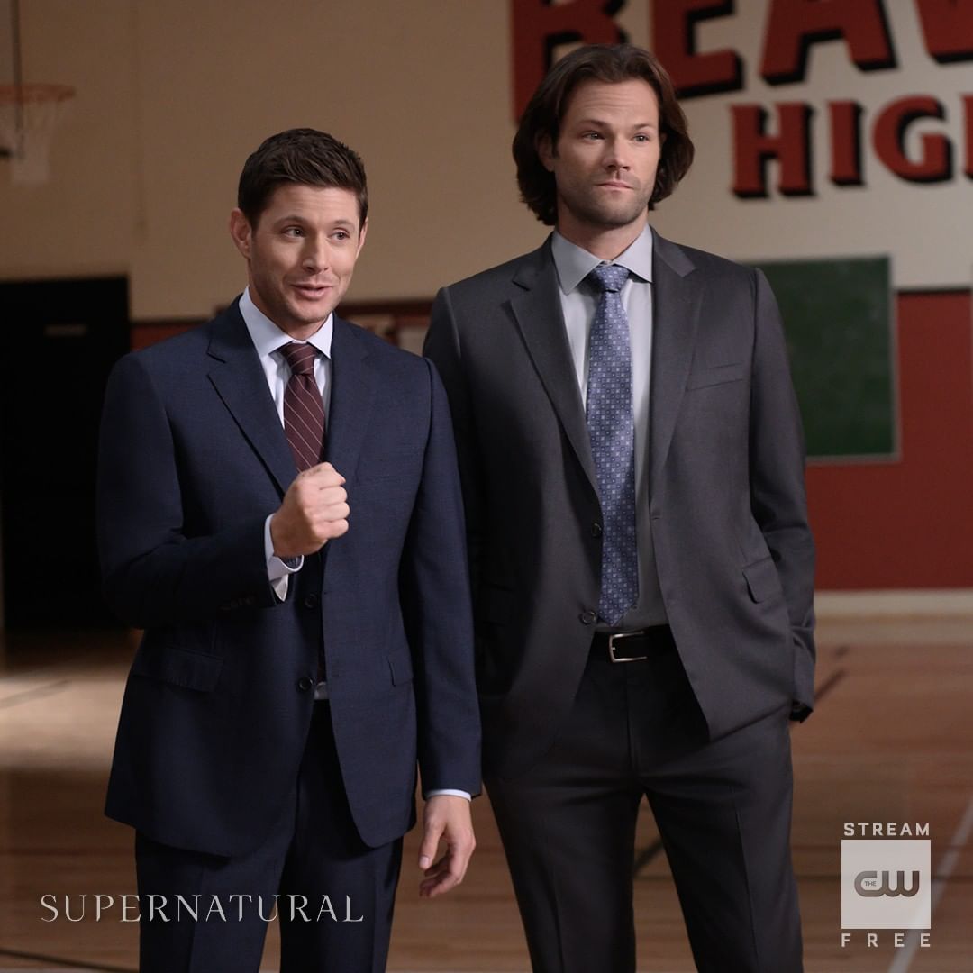 A picture of Sam and Dean from a scene and they both look gorgeous in suits.