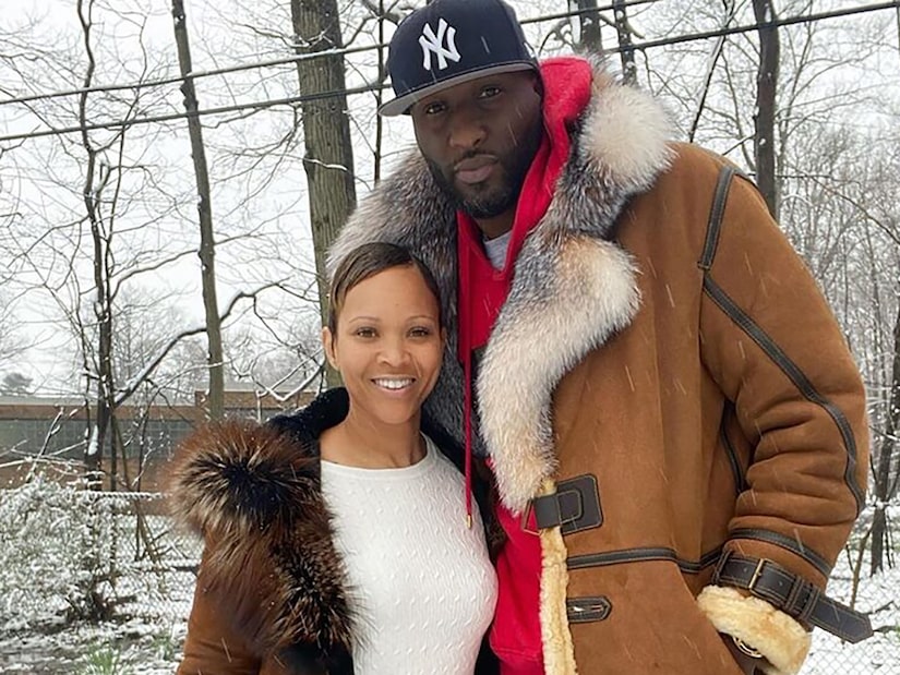 Lamar and Sabrina posing for a photo outside in the snow