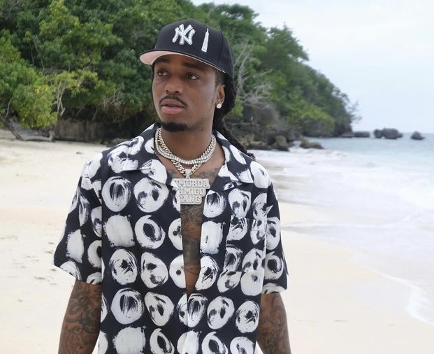 Quavo relaxing by the beach.