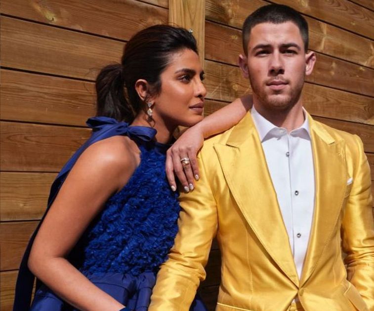 Nick Jonas with gold suit on 