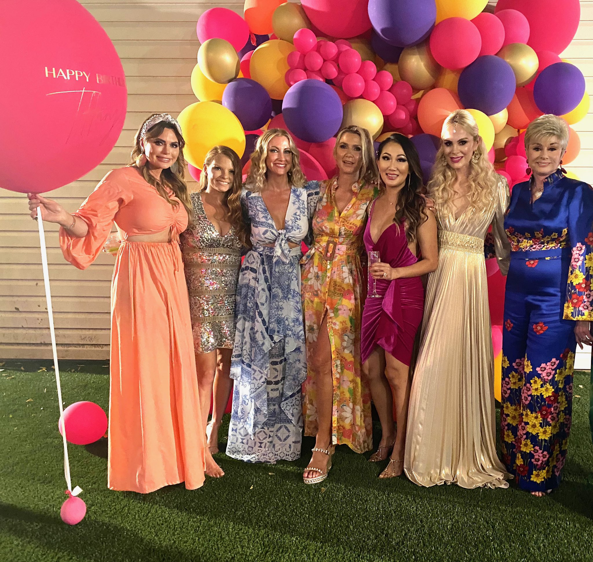 Dr. Tiffany Moon celebrates with 'RHOD' cast in dresses.