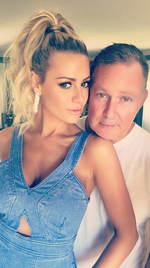 Dorit Kemsley wears jean and sits on PK's lap.
