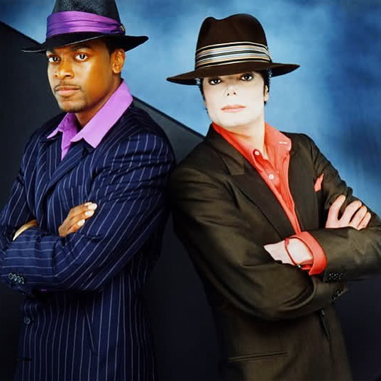 A photo showing Chris Tucker and Michael Jackson in a blue stripped and brown suit respectively, paired with similar hat designs.