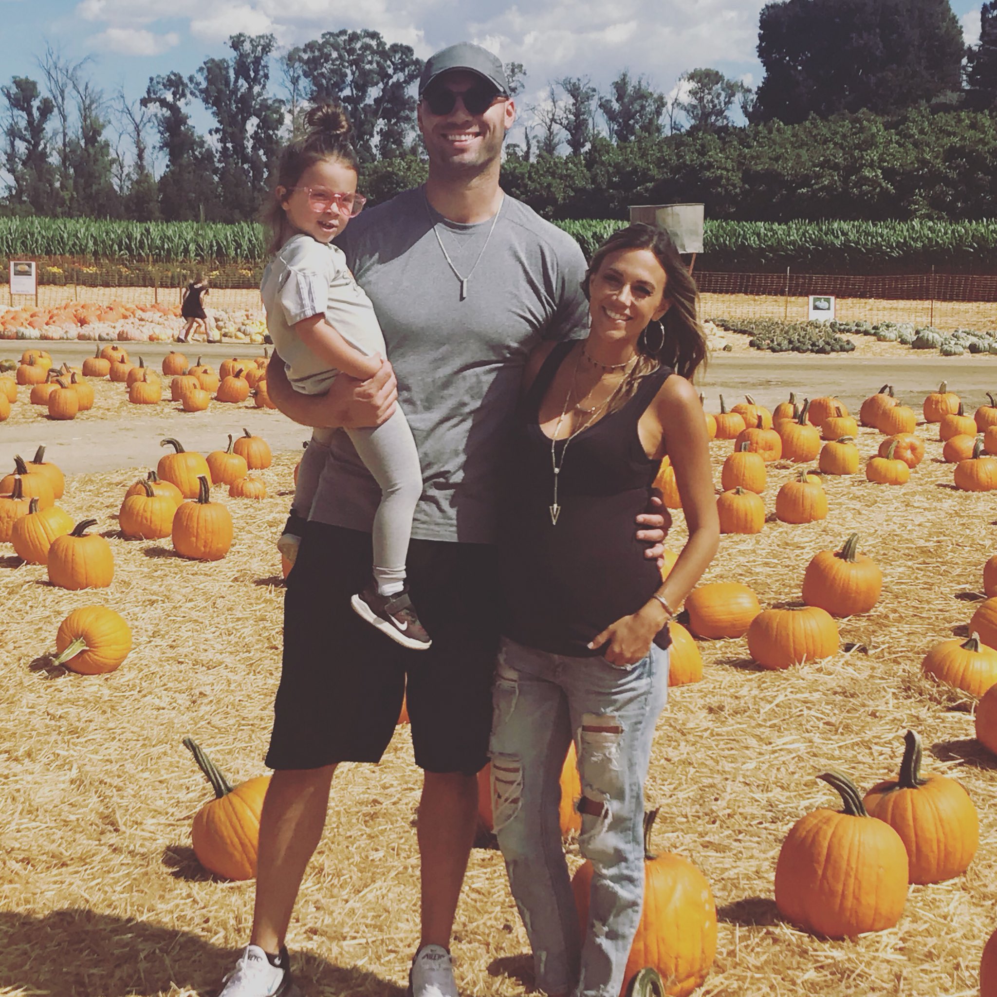 Jana Kramer and husband Mike Caussin visit a pumpkin patch.