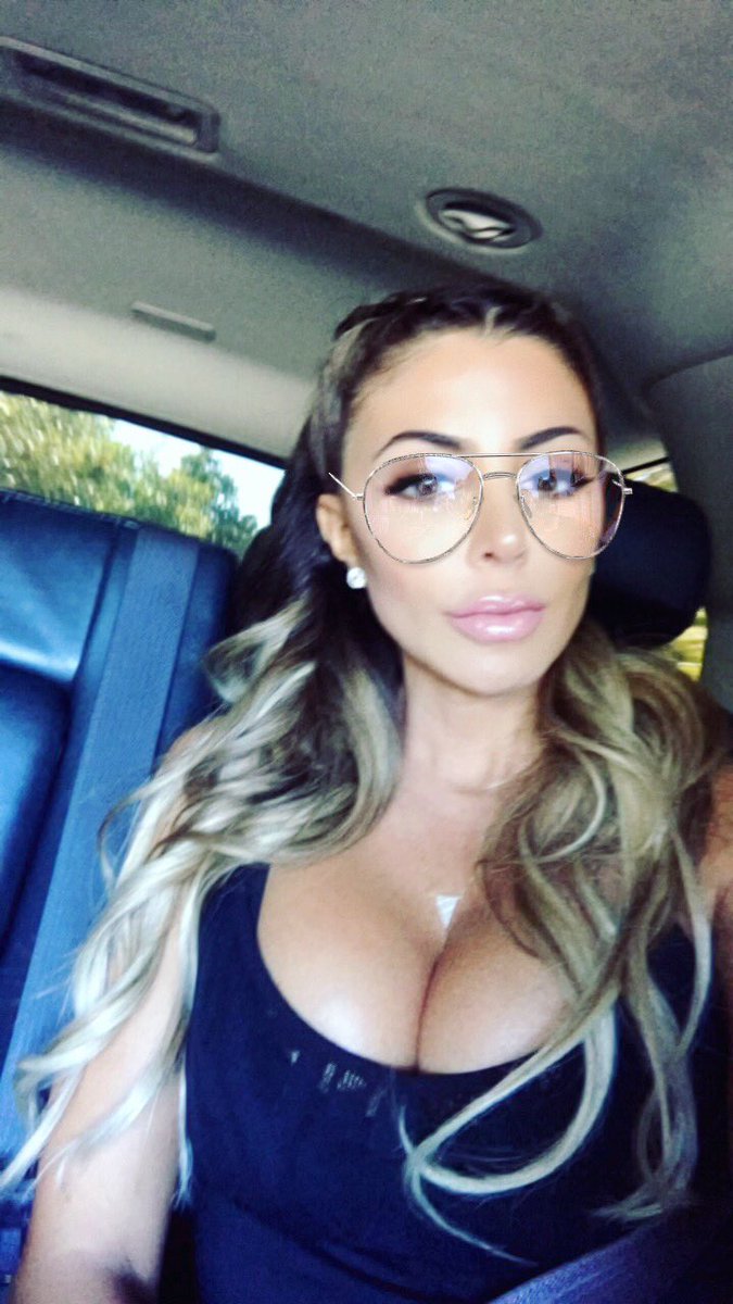 Larsa Pippen shows off cleavage and glasses.