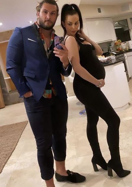 Scheana Shay shows off baby bump with Brock Davies in a suit.