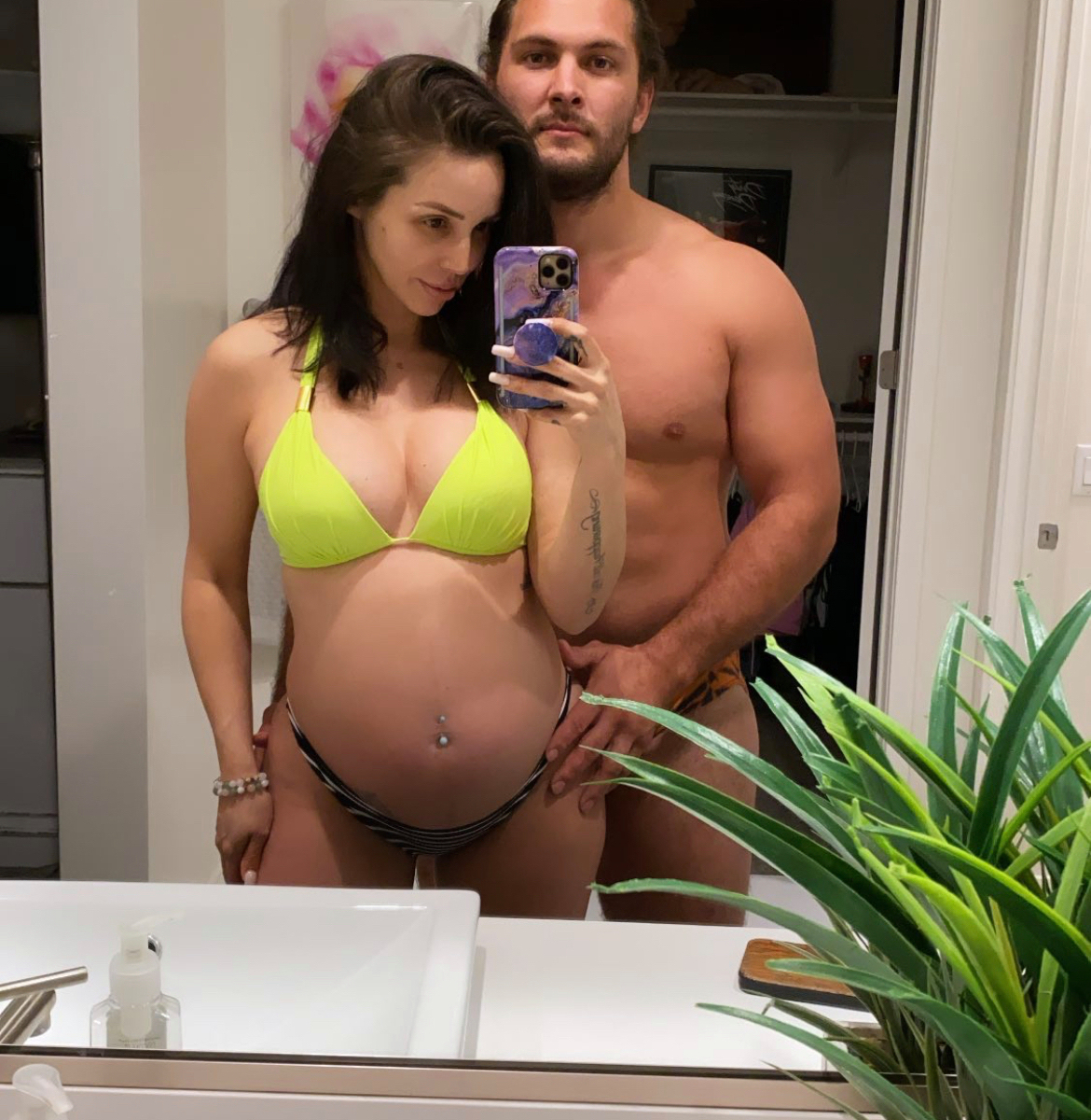 Scheana Shay wears a yellow bikini with Brock Davies.