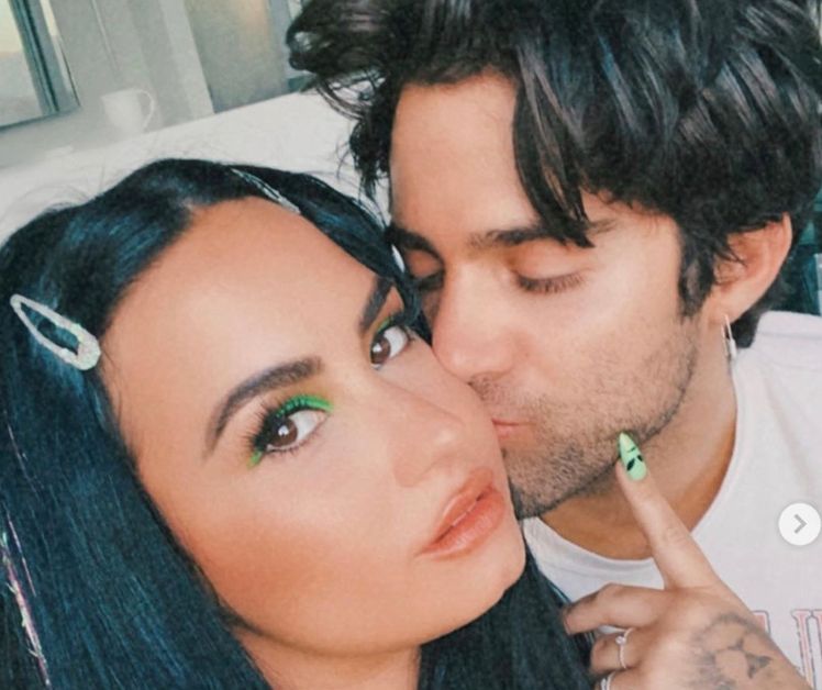 Demi Lovato and Max Ehrich kissing