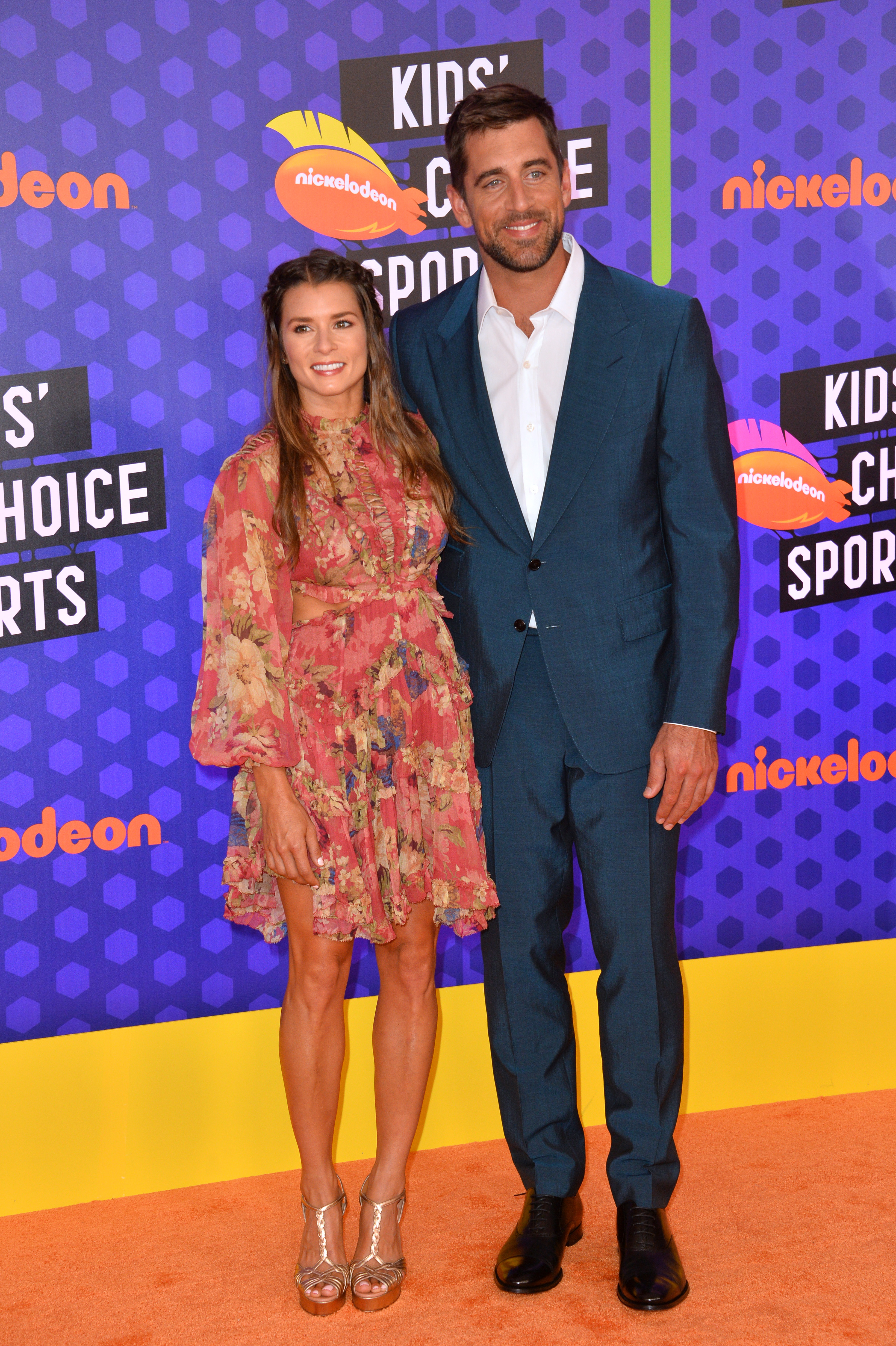 A photo showing Danica Patrick and Aaron Rodgers at an event and they look amazing.