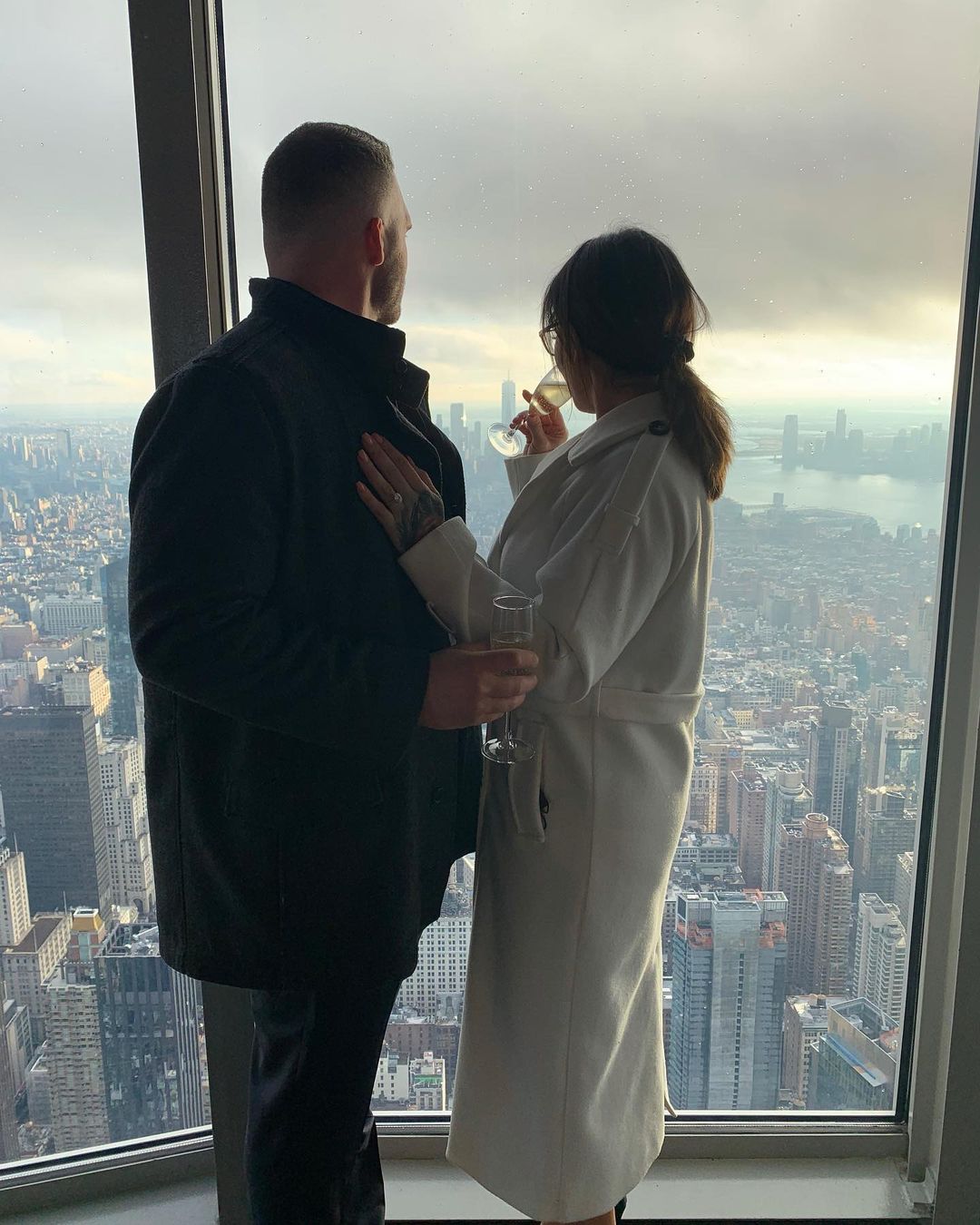 An incredible photo showing Jenni JWoww Farley and Zack Carpinello sharing a glass of champagne to commemorate their engagement.