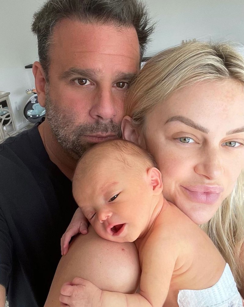 Lala Kent holds daughter Ocean on her shoulder.