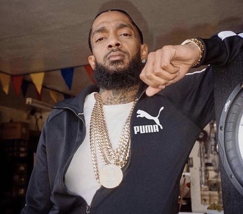 Nipsey Hussle posing for a photo.