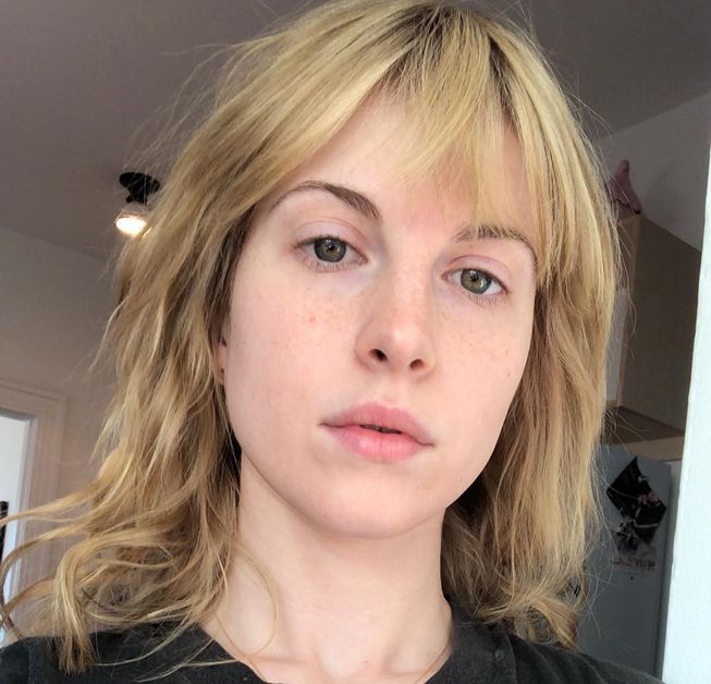 Hayley Williams takes a no-makeup selfie with her dirty blonde hair loose around her face.