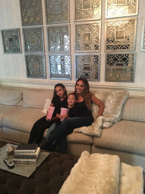 Melissa Gorga eats popcorn with her daughter and son.