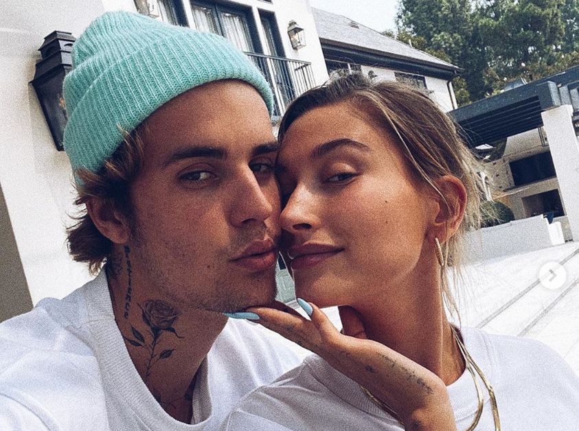 Justin Bieber with Hailey wearing hat