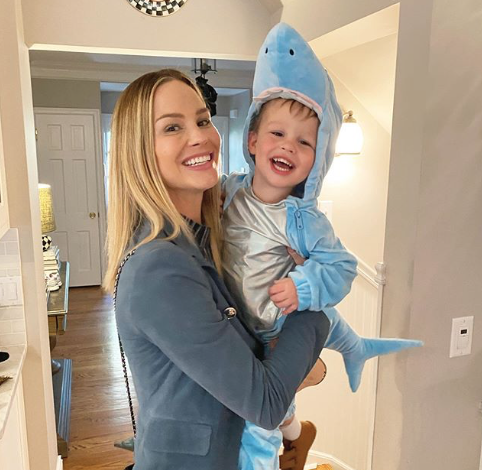 Meghan King Edmonds holds son Hart in a shark costume.