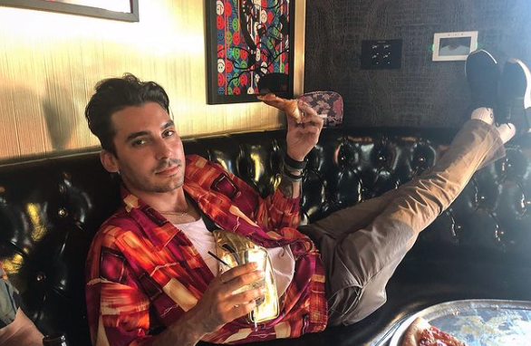 Max Boyens wears a red shirt at Rocco's in West Hollywood.