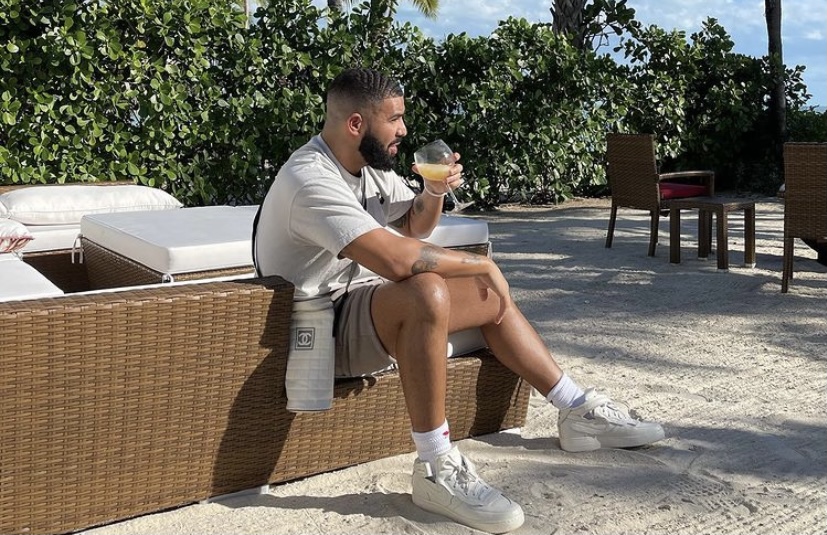 Drake relaxing pool side.