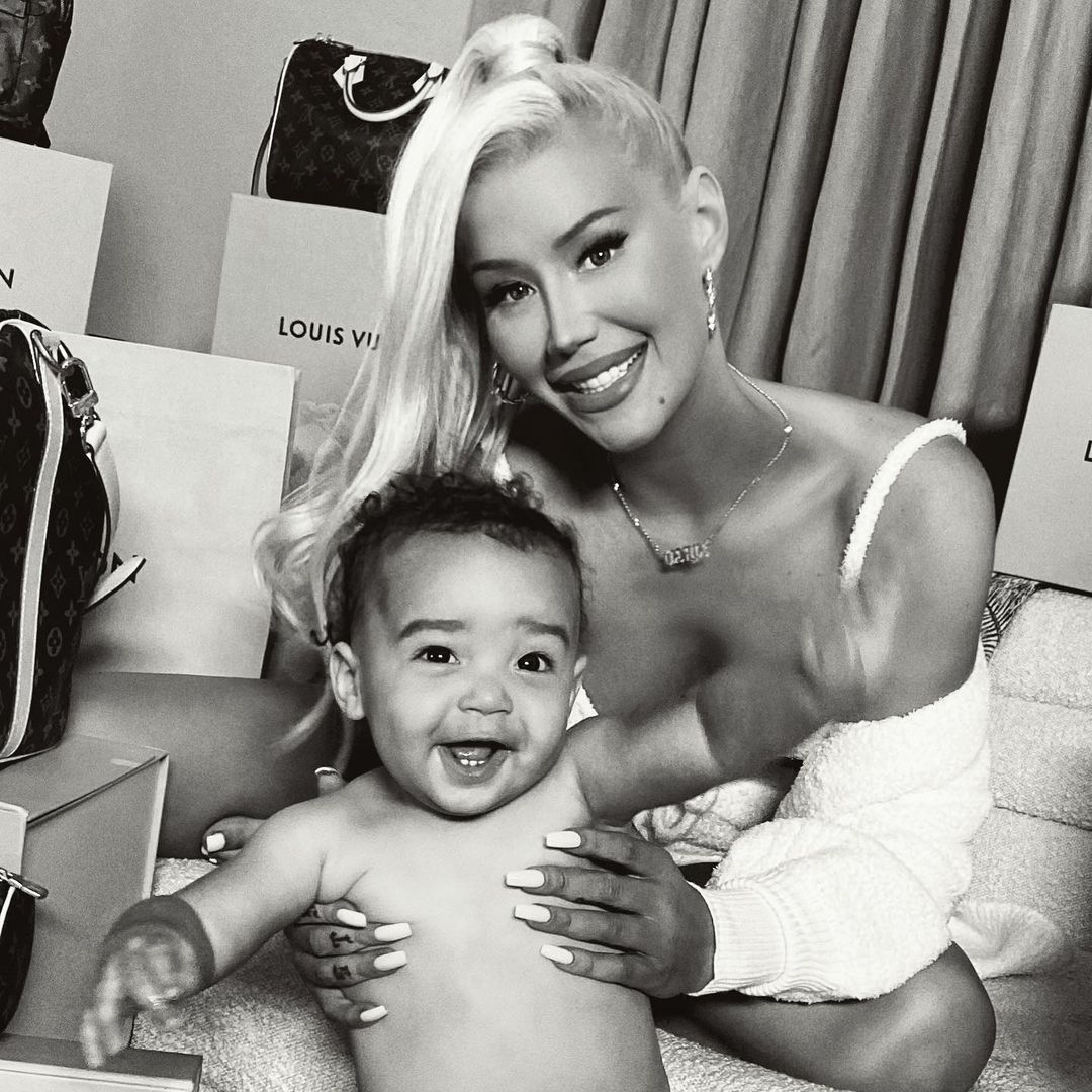 Iggy Azalea and baby Onyx bond beautifully in a room filled with expensive outfits and shoes.