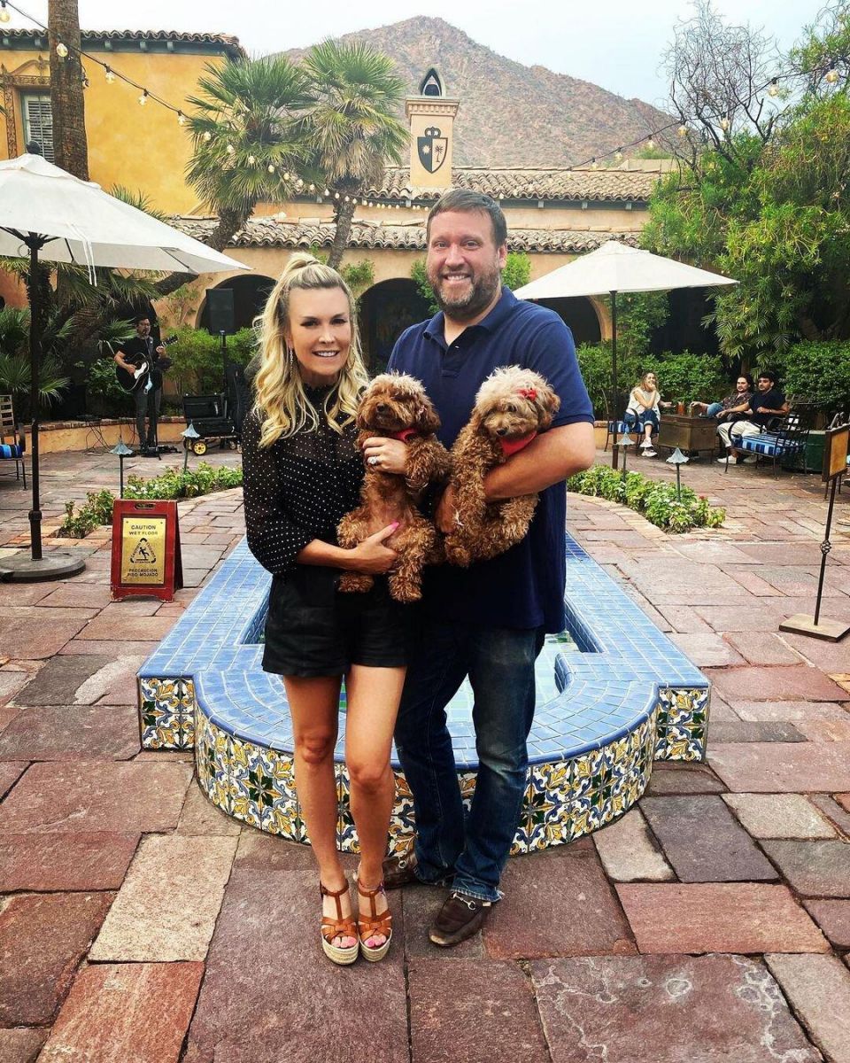 Tinsley Mortimer and Scott Kluth hold their two dogs.