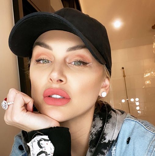 Lala Kent wears a black baseball hat.