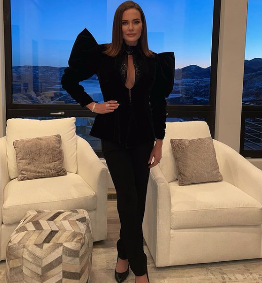 Meredith Marks wears a black blazer and matching pants.