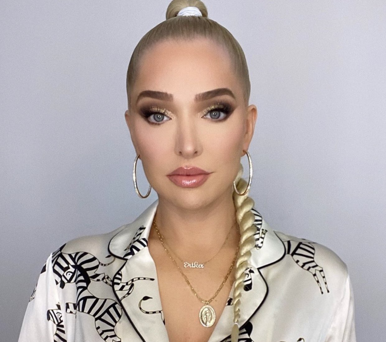 Erika Jayne wears a braided ponytail.