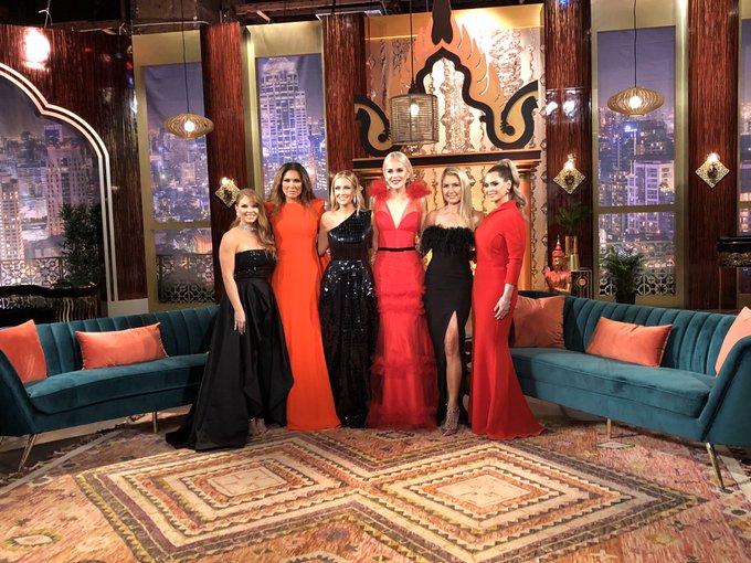 The 'RHOD' cast wears black and red gowns on the season four reunion set.