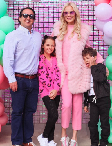 Kameron Westcott wears pink fur with her family,