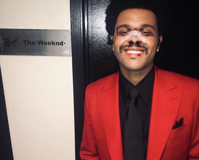 The Weeknd's red suit and bandaged face has been a signature look for him this year.