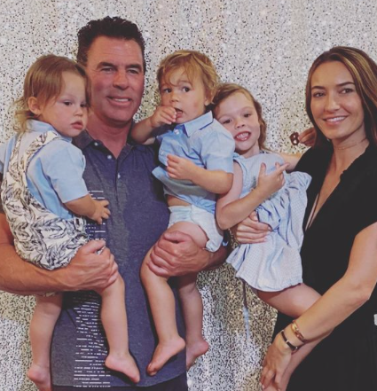Jim Edmonds and Kortnie O'Connor hold his three youngest children.