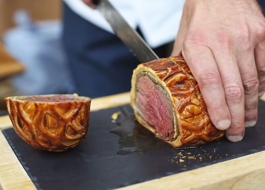 Chef Gordon Ramsay takes a close-up video, showing fans how to slice a Beef Wellington. 