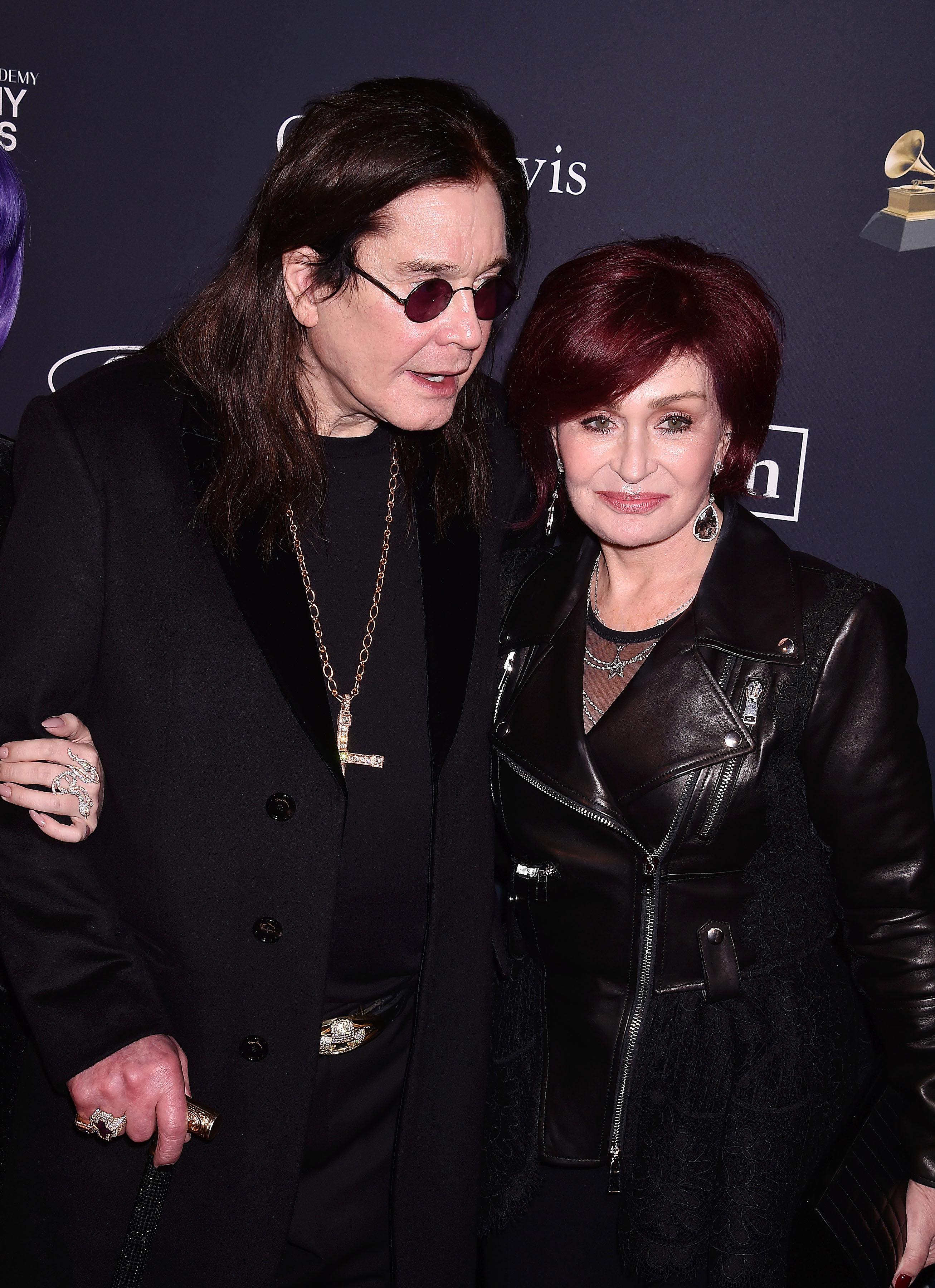 A photo showing. Sharon Osbourne and Ozzy Osbourne posing for a photograph at an event.