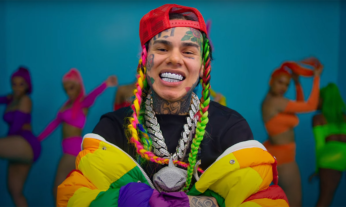 6ix9ine smiling in his 'GOOBA' music video.