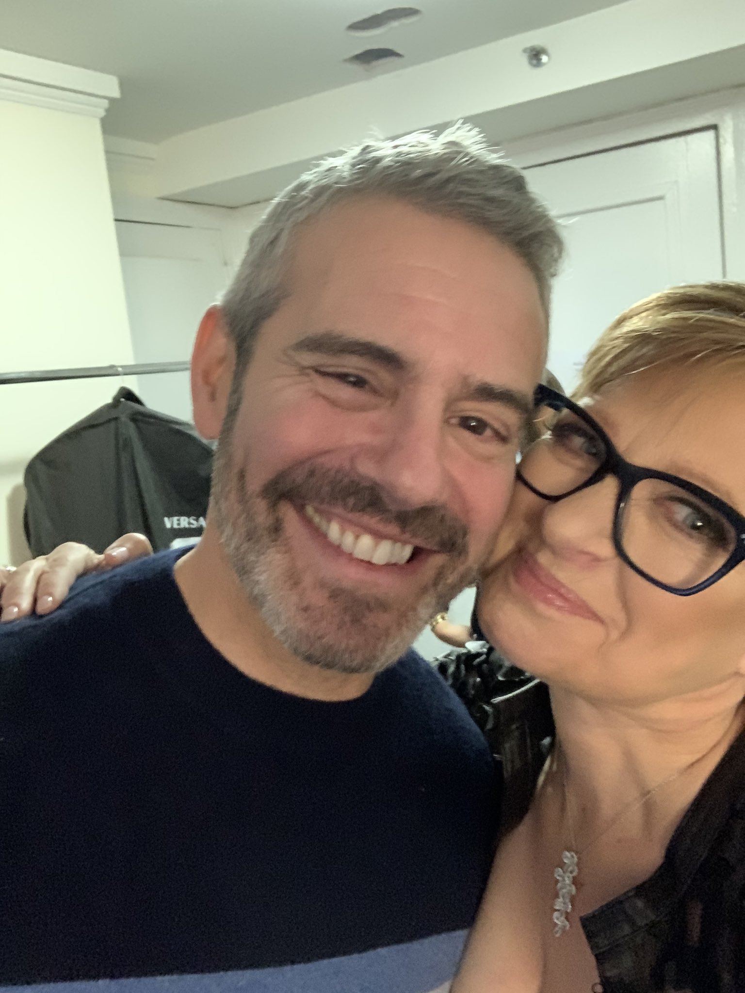 Andy Cohen poses cheek to cheek with Caroline Manzo.