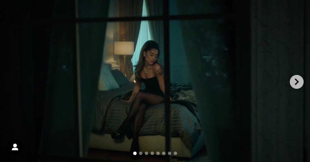 Ariana Grande on bed looking sexy