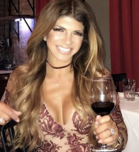 Teresa Giudice enjoys a glass of wine.