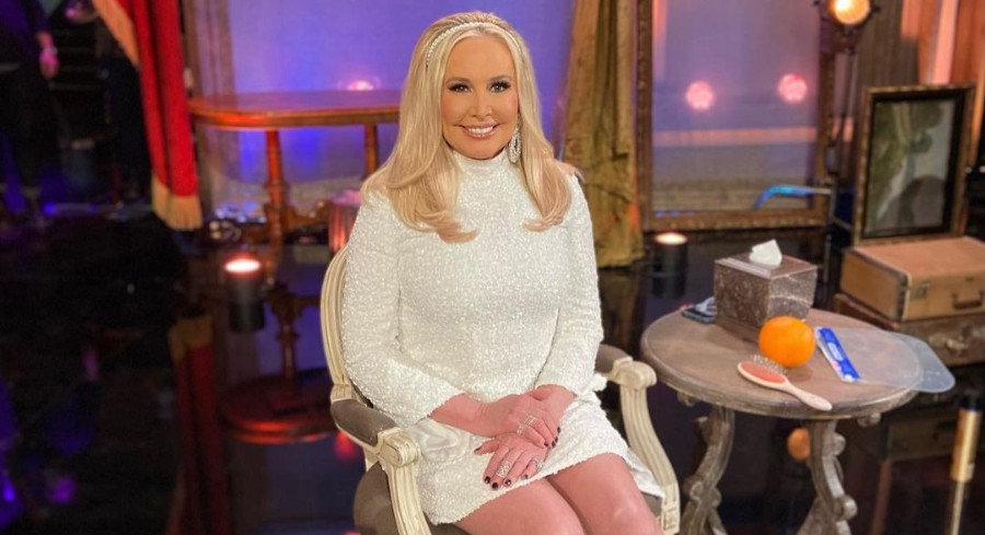 Shannon Beador wears a white dress and a pearl headband.