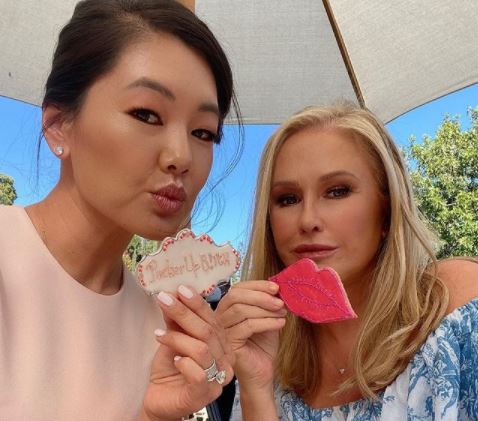 Crystal Kung Minkoff and Kathy Hilton eat cookies.