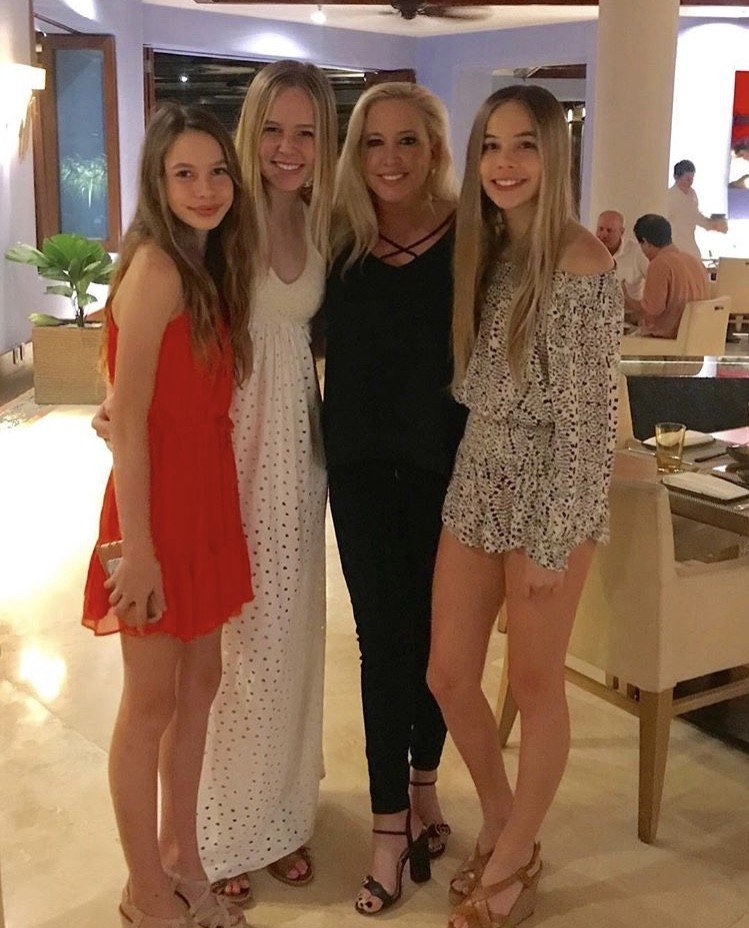 Shannon Beador stands with her dress-wearing daughters.