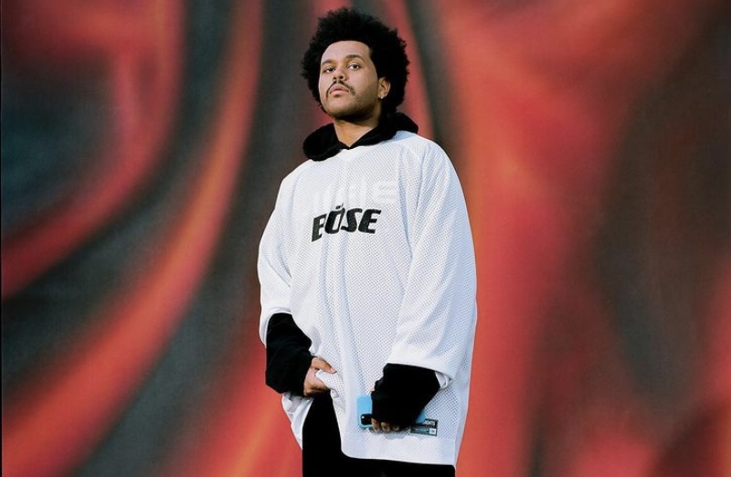 The Weeknd sporting his Bose shirt.