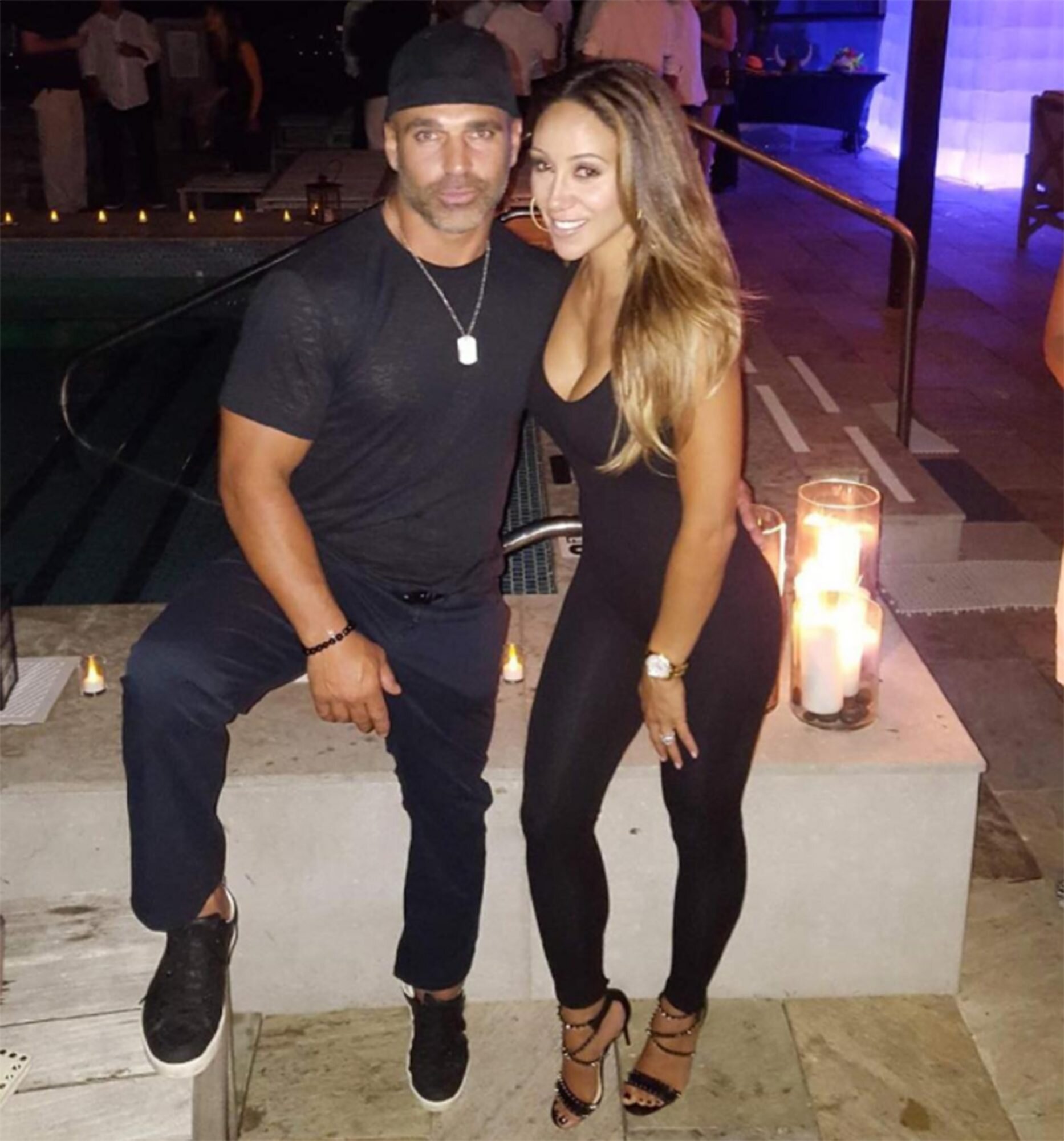 Melissa Gorga and Joe Gorga wear matching black outfits.