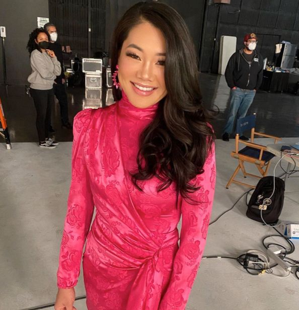 Crystal Kung Minkoff wears a pink wrap dress.