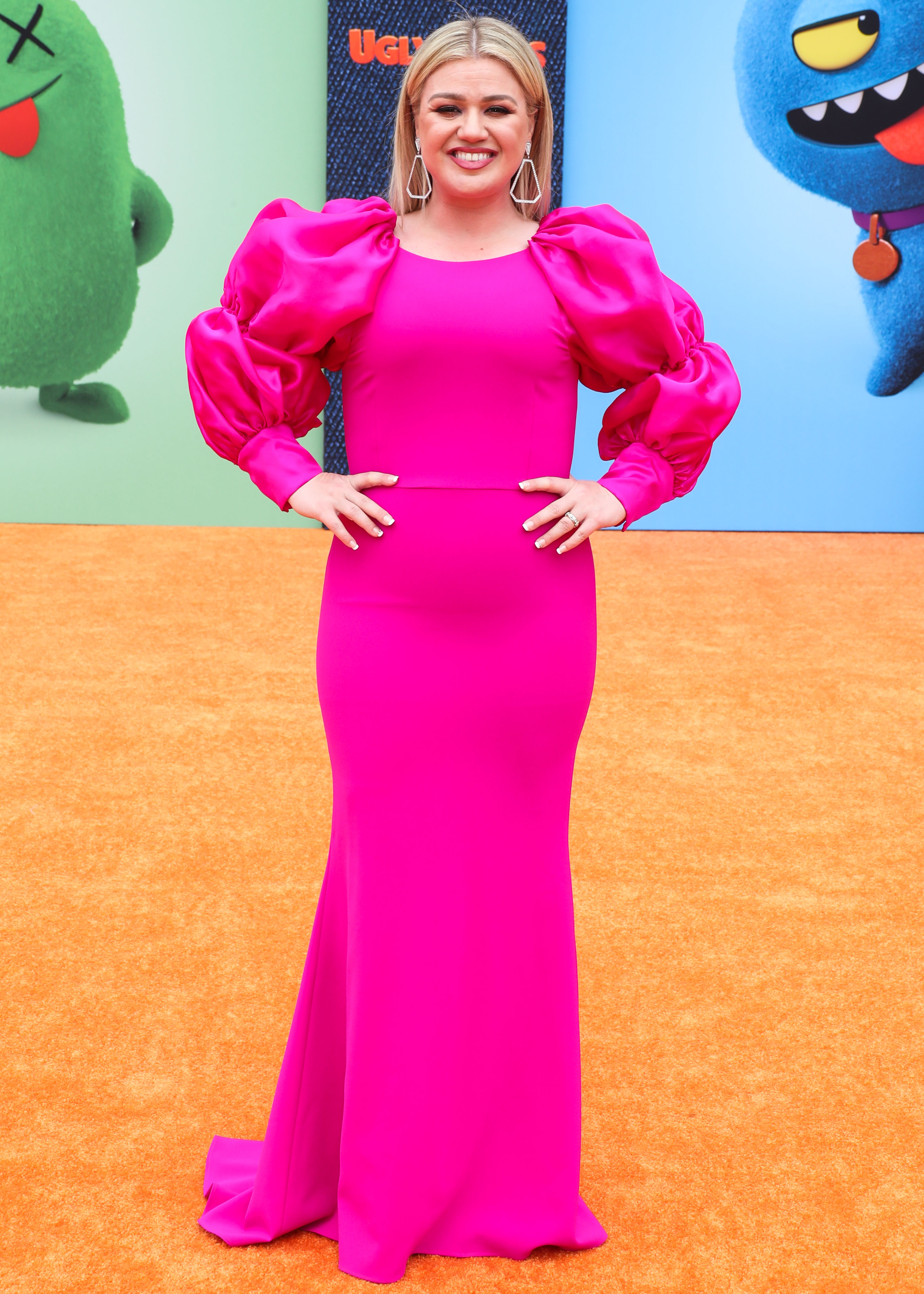 A photo of Kelly Clarkson in this beautiful pink dress at an event.