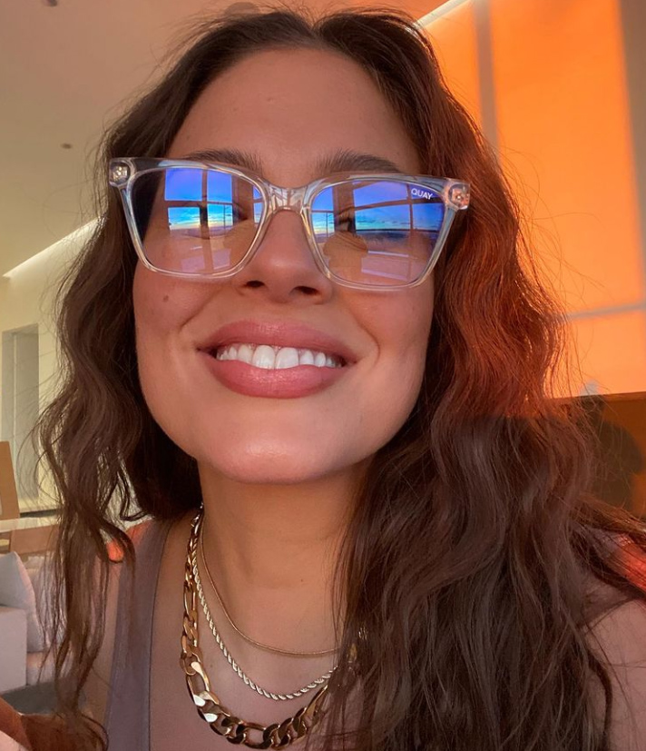 Ashley Graham wearing blue glare-blocking glasses