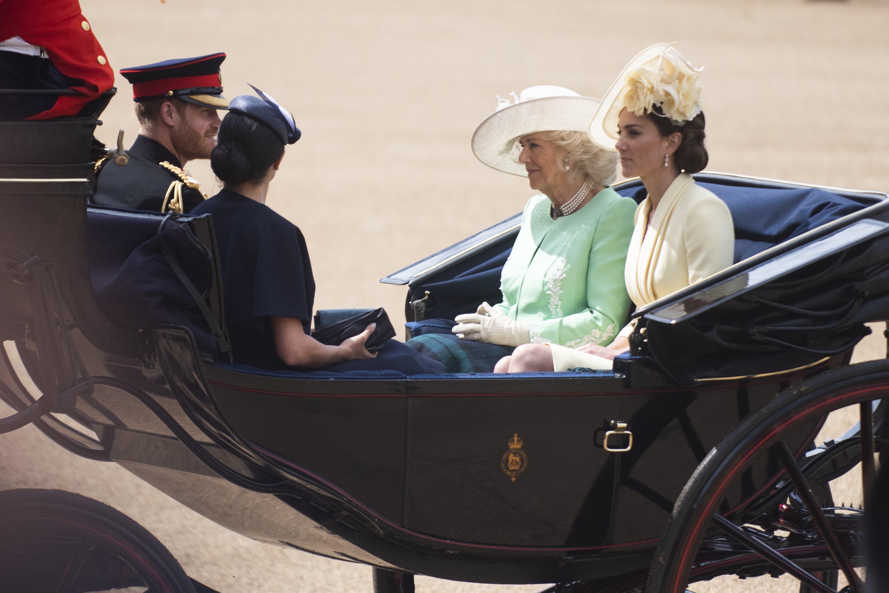 Prince Harry, Queen Elizabeth, Meghan Markle, and Kate Middleton photographed candidly