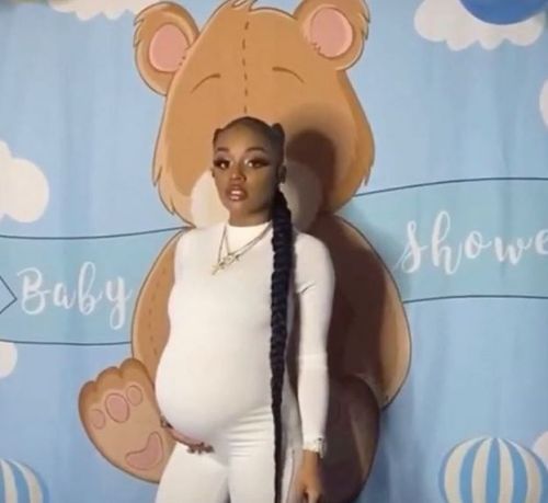 Mayweather showing off her baby bump at her baby shower.