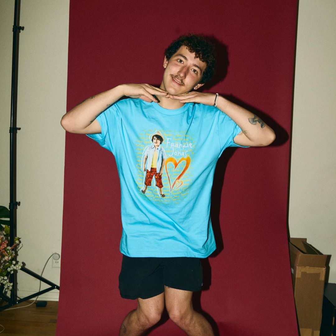 Franklin Jonas shows off a goofy pose in this photo showing him in a blue shirt and black short.