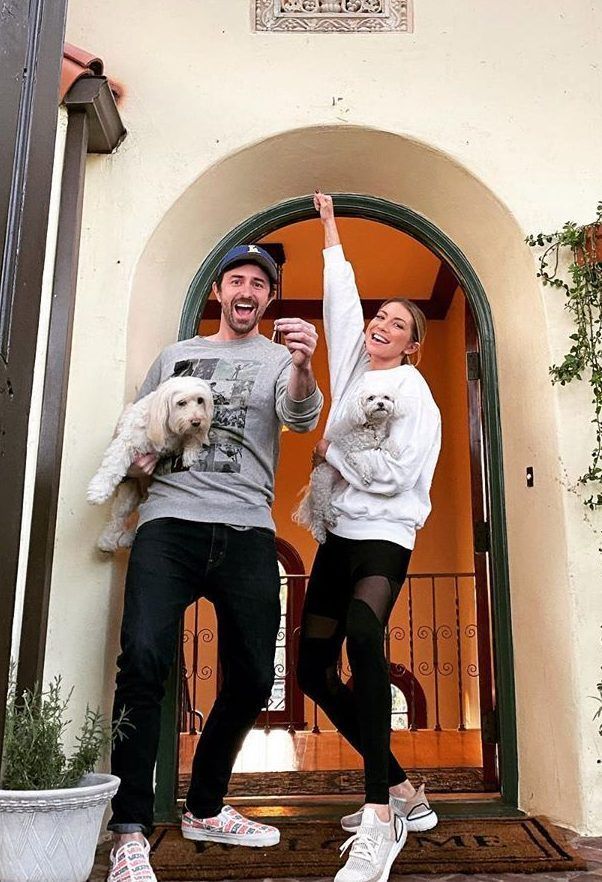 Stassi Schroeder and Beau Clark show off the keys to their new home.